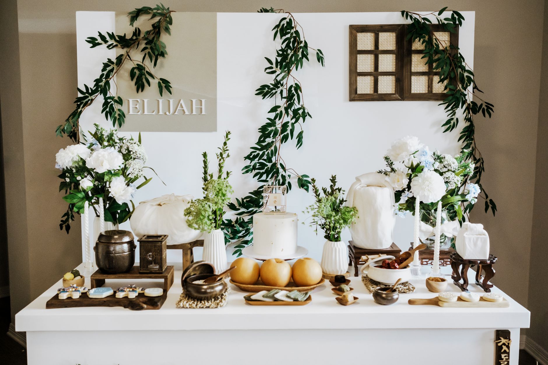 Beautifully decorated Korean Dohl table with traditional elements and floral arrangements.