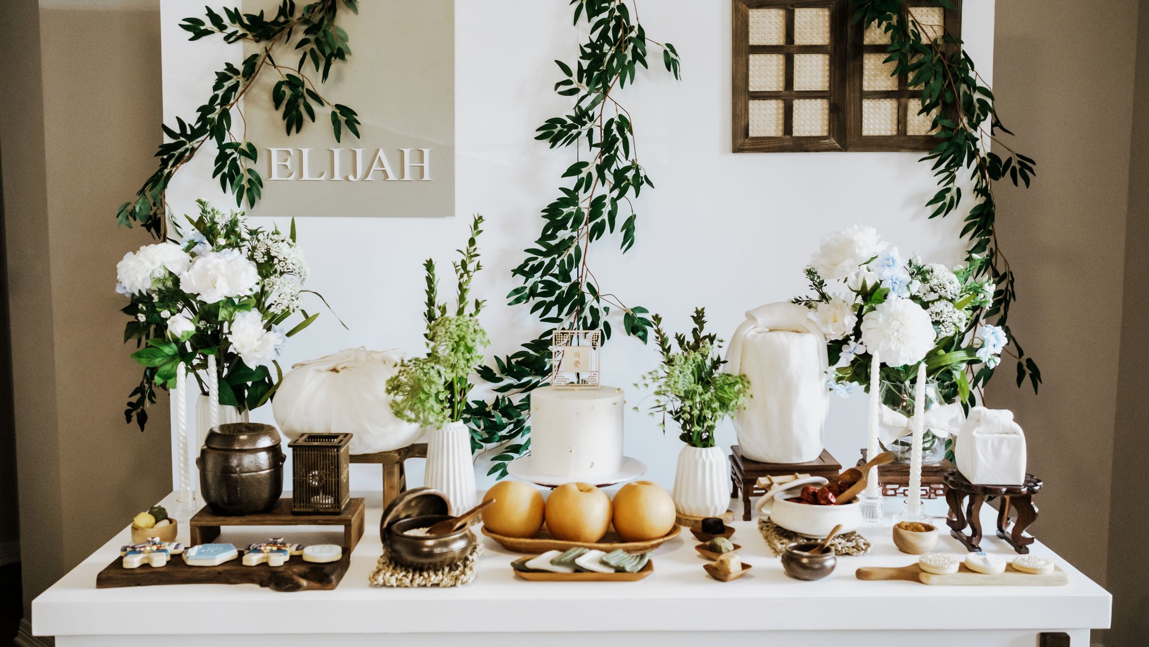 Beautifully decorated Korean Dohl table with traditional elements and floral arrangements.