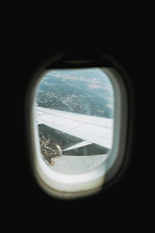A view of an airplane window from inside the plane