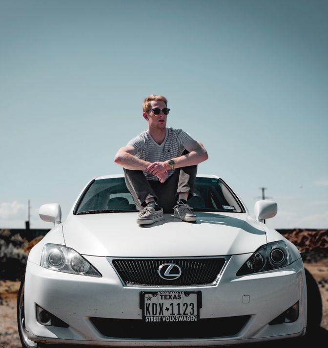 Vehicle owner lovingly caring for and maintaining his car