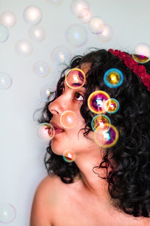 Woman Playing With Bubbles