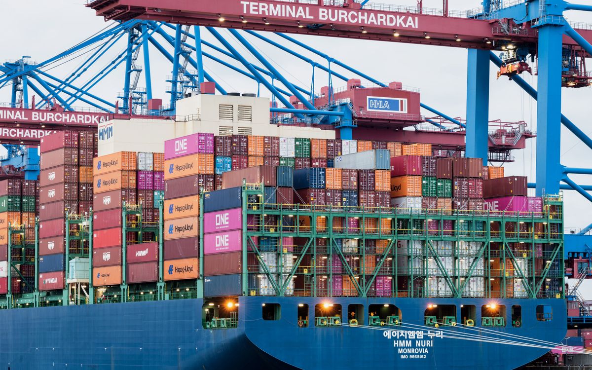 Free Container ship at Terminal Burchardkai, Hamburg harbor. Stock Photo