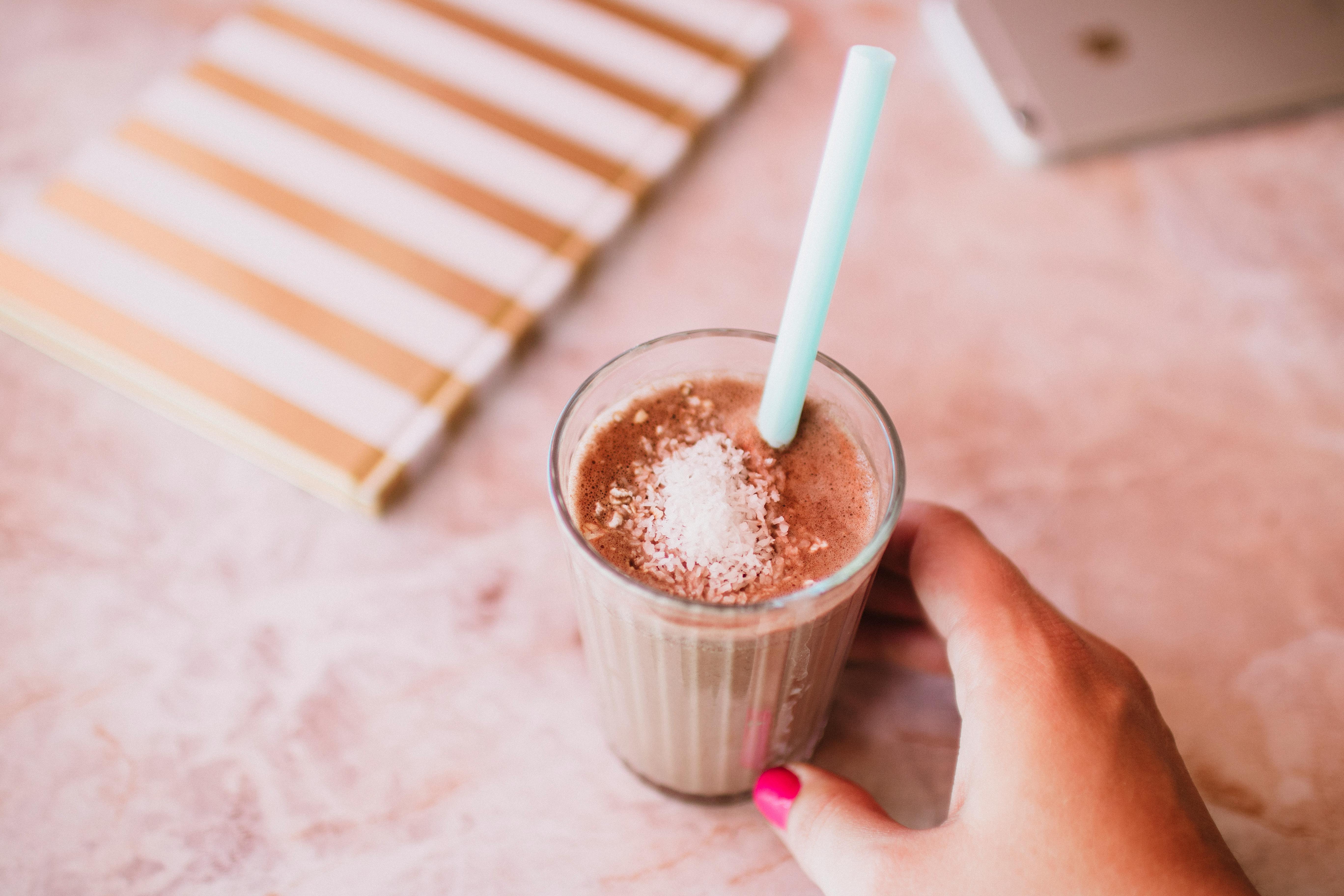 A refreshing iced chocolate drink topped with cocoa powder, perfect for a summer day.