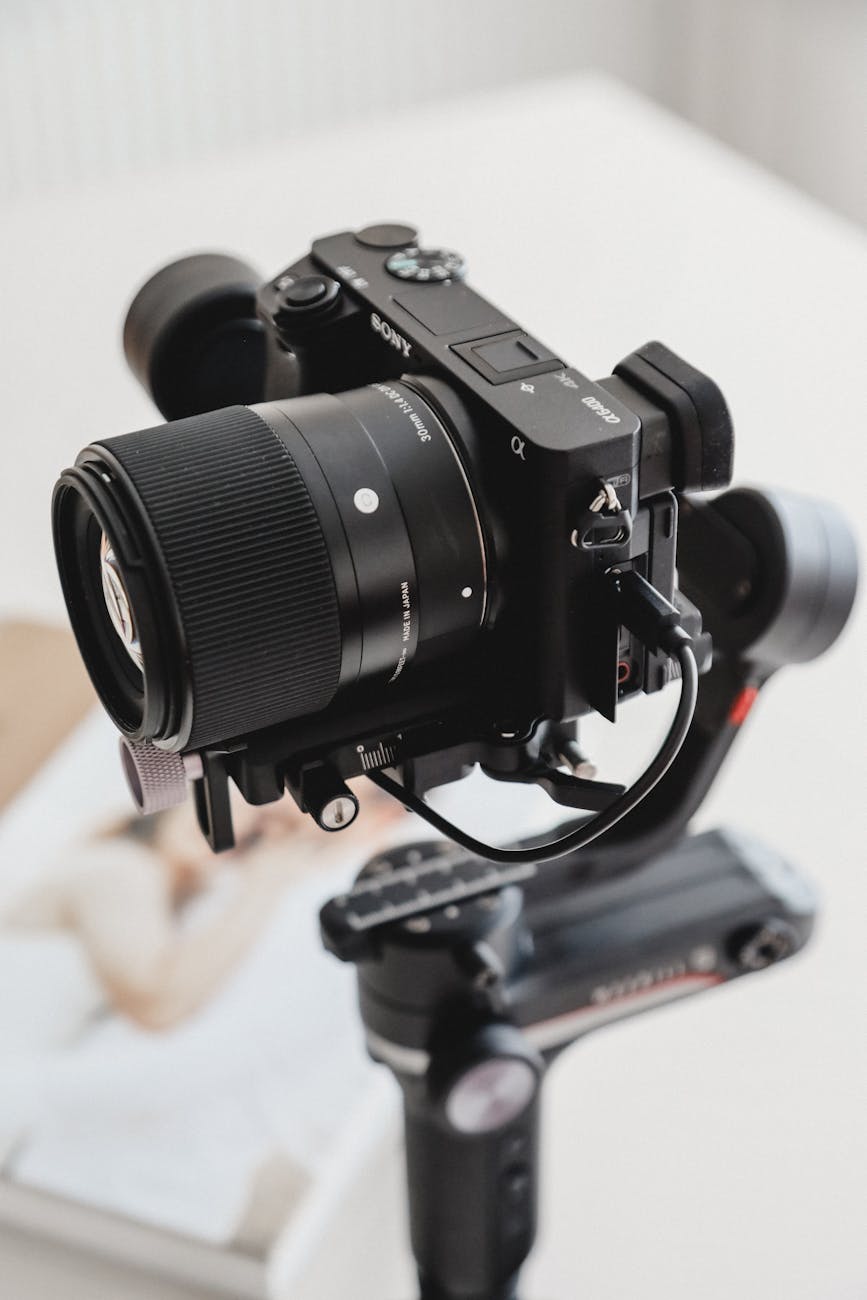Close-up of a Sony camera mounted on a tripod for professional photography.