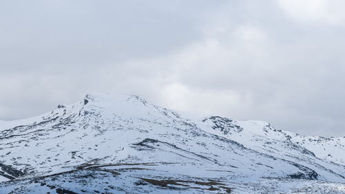 Free Scenic view of a snow-covered mountain in Santander, capturing the serene winter beauty Stock Photo
