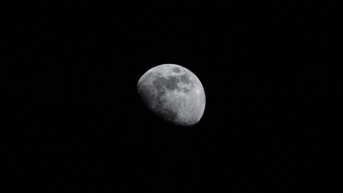 Free Stunning image of the waxing gibbous moon against a black sky, offering ample copy space. Stock Photo