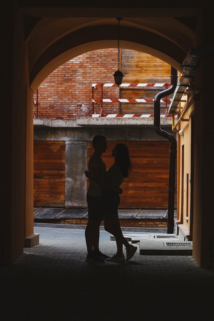 Silhouette Of Couple Hugging Each Other