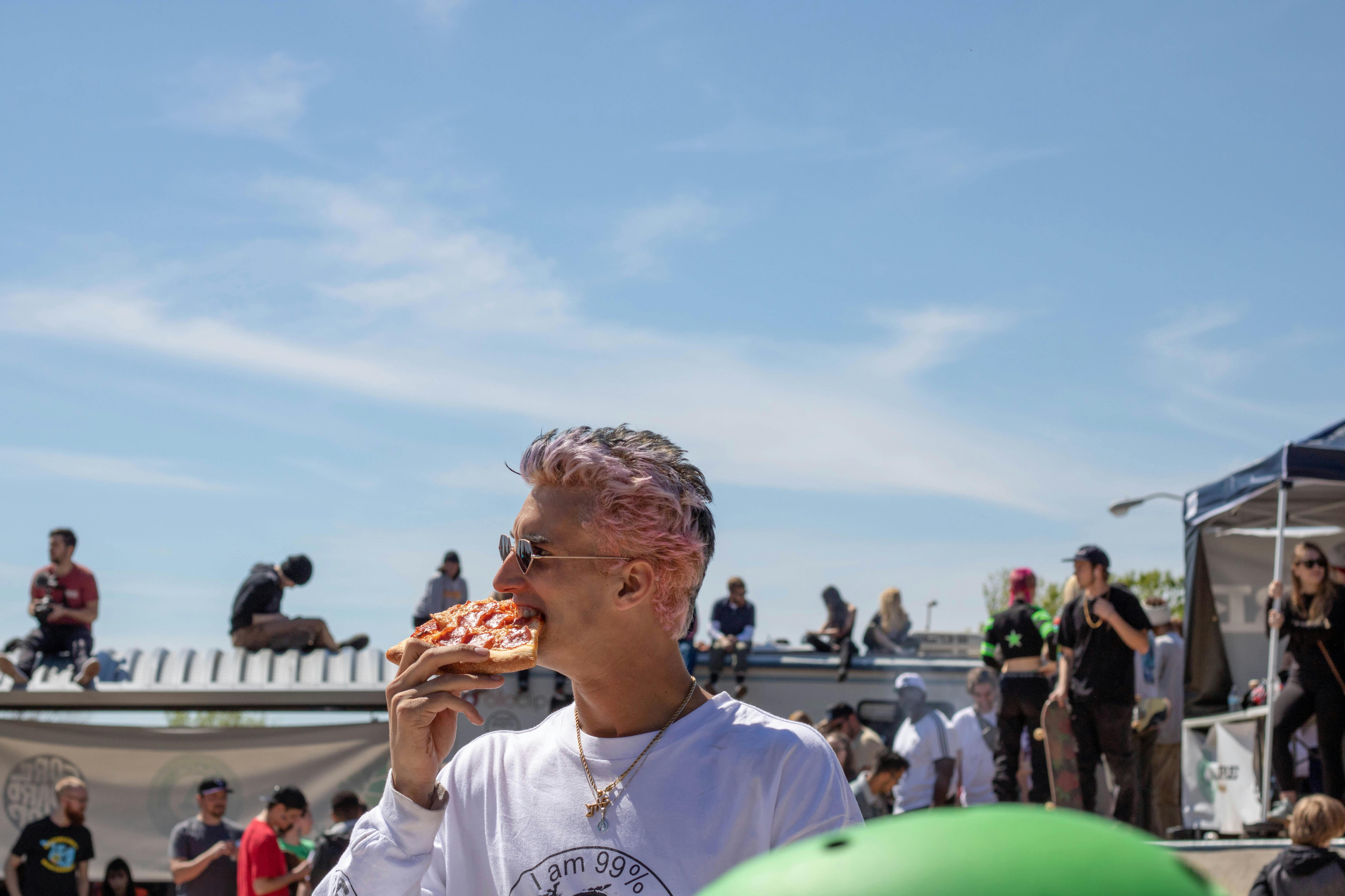 People enjoying food at a food truck festival in Manchester