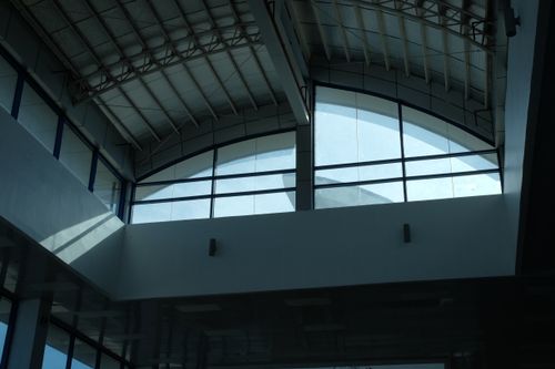 Free Low angle view of a modern glass ceiling in Laguindingan building, Philippines. Stock Photo