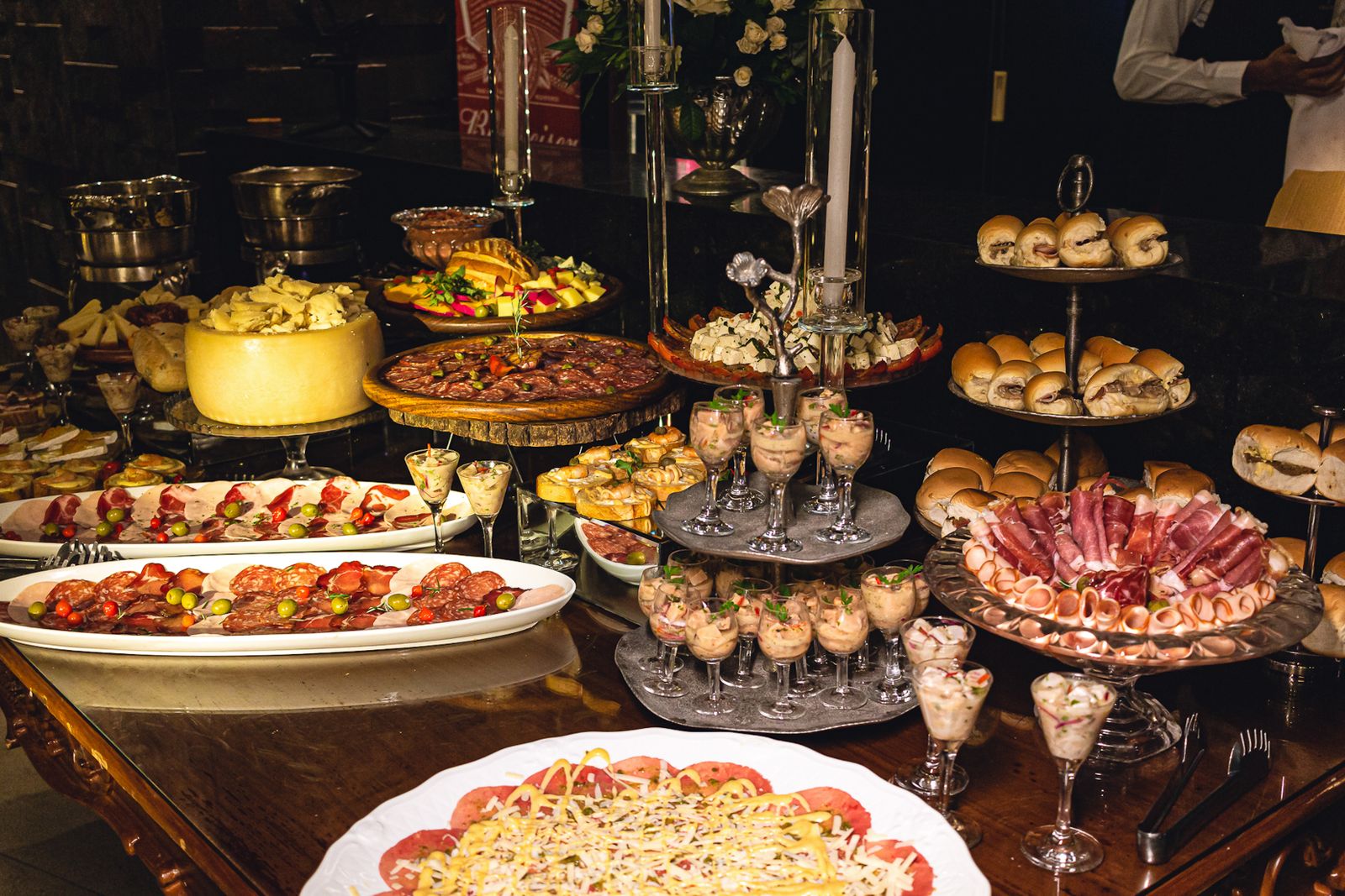 Rich evening buffet with canapés, cold cuts and tiered serving stands