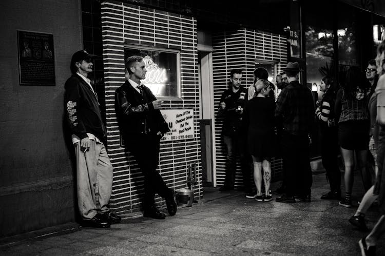 People Standing Outside A Building