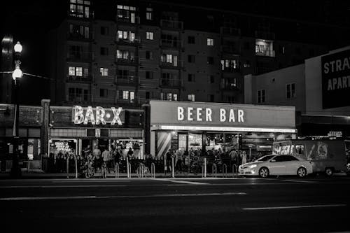 Grayscale Photo of Beer Bar Signage
