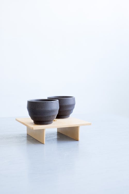 Gray Ceramic Bowl on Brown Wooden Rack