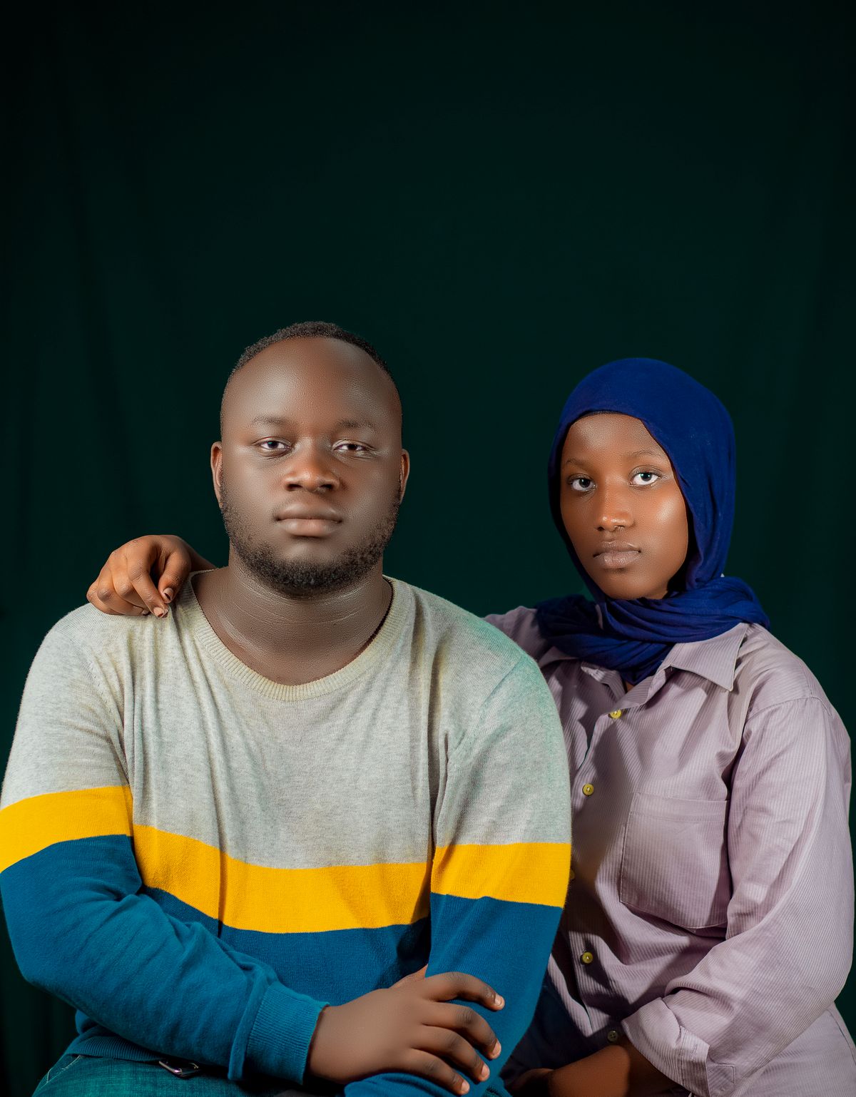 Portrait of a Stylish Couple in Traditional Attire · Free Stock Photo