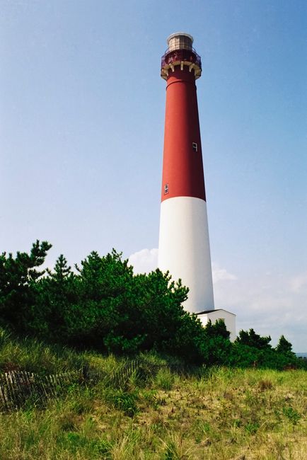 Barnegat Lighthouse stands tall under a clear blue sky in New Jersey, USA.
