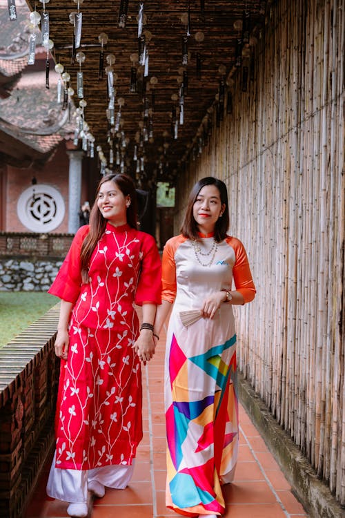 Two women in traditional clothing standing next to each other