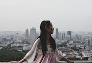 Woman Wearing White and Pink Dress Lean on Railings