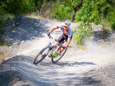 A man riding a mountain bike down a dirt trail