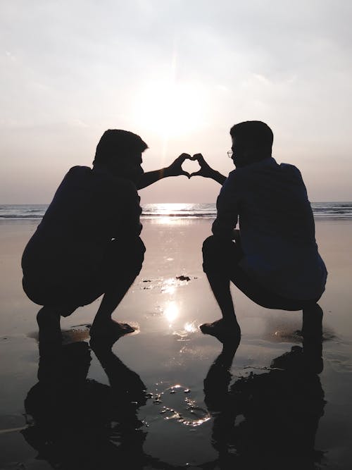 Free Silhouette of 2 Man Making Heart Sign Stock Photo