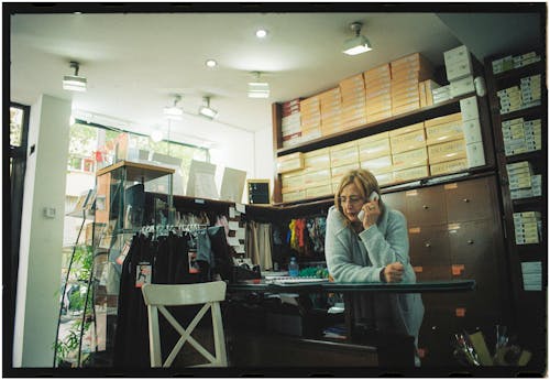 A woman sitting at a desk in a store