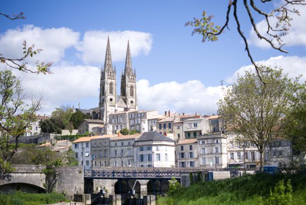 Majestic view of Eglise Notre-Dame's gothic spires above the cityscape of Niort, France