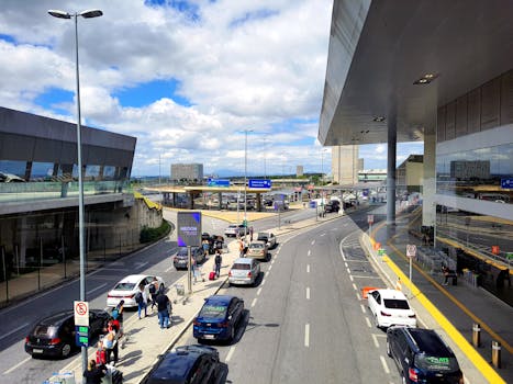 A bustling scene at the entrance of Tancredo Neves International Airport in Belo Horizonte, Brazil.