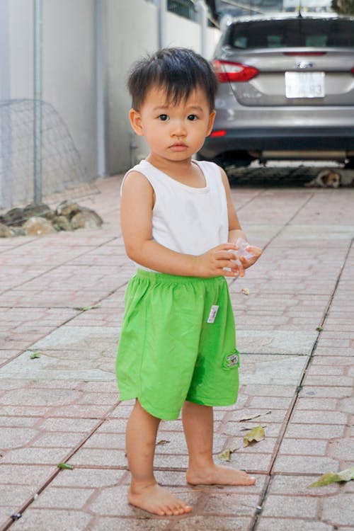 Photo of Boy Standing Outside