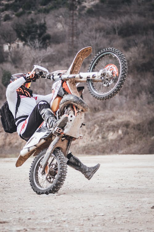 Person Riding Yellow Dirt Bike