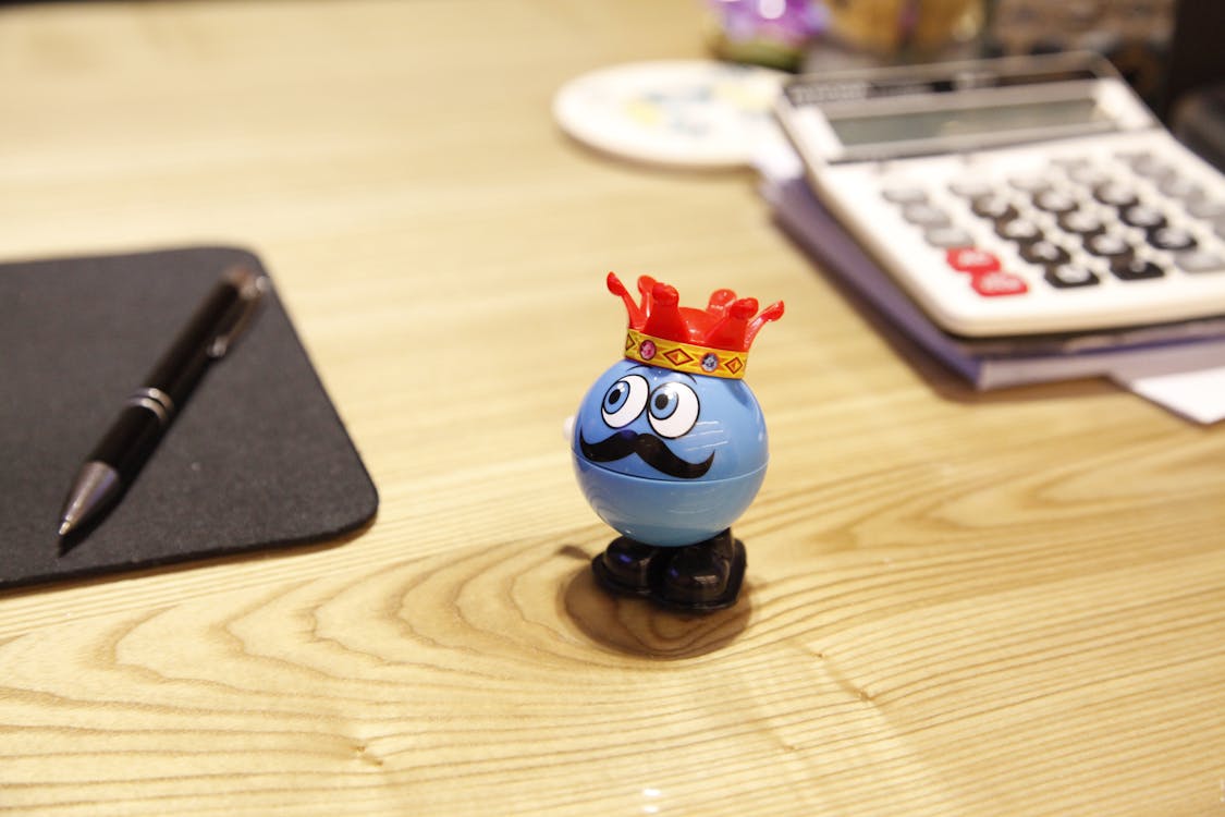 Blue Round Plastic Toy on a desk