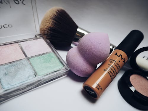 Free Nyx Lipstick Beside Eye Shadow Palette Stock Photo