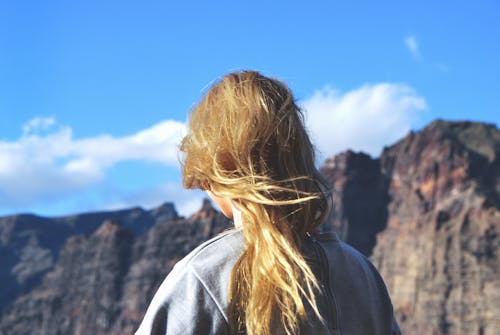 Woman Standing With Mountain As Background