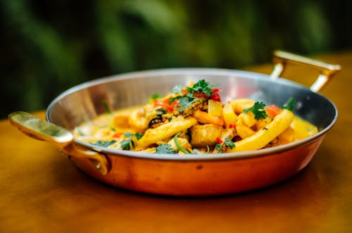 A pan filled with food on a table