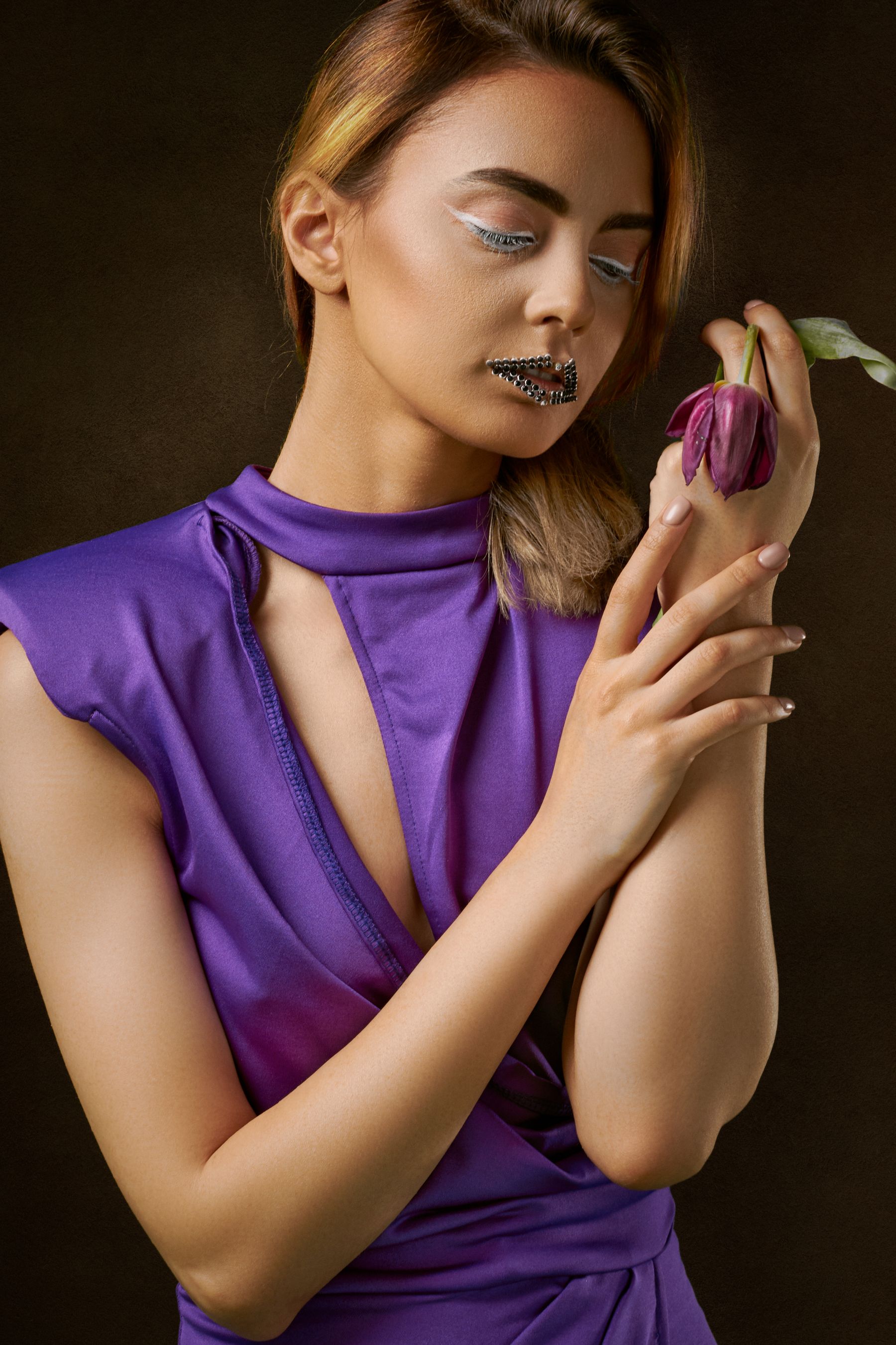 Classic lipstick photographed on a minimal surface
