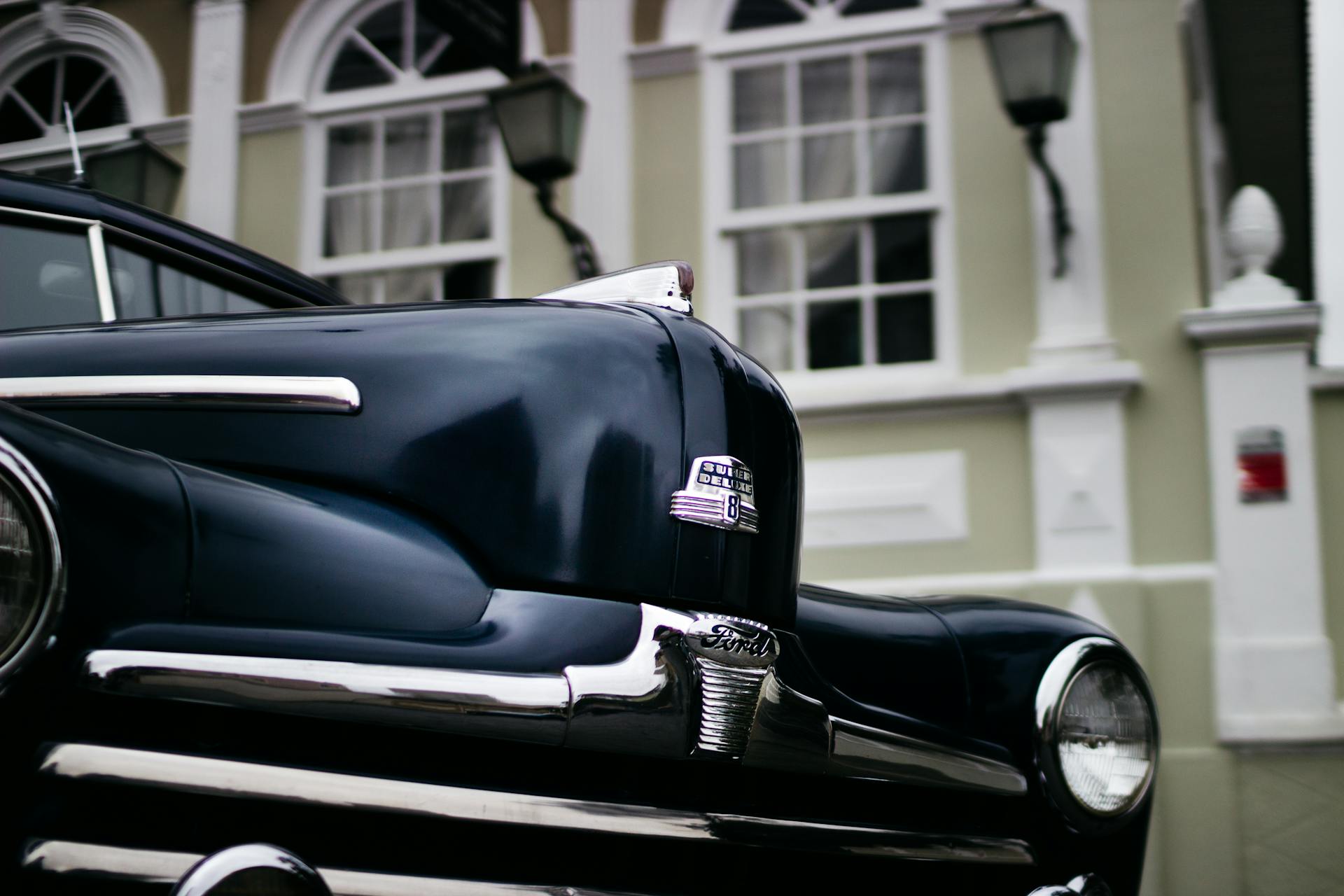 Close-up of a vintage Ford car parked on a street in Curitiba, Brazil.