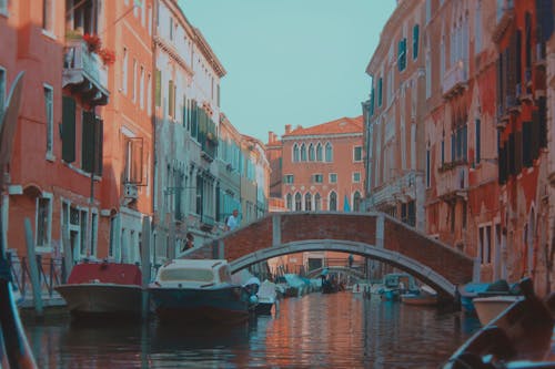 A canal in venice with a bridge over it