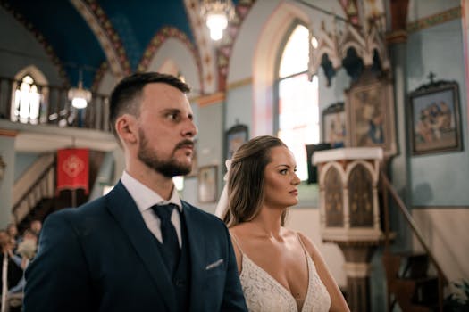 Bride and groom standing in a beautifully decorated church during their wedding ceremony.