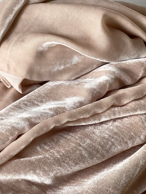 A close up of a pink velvet blanket