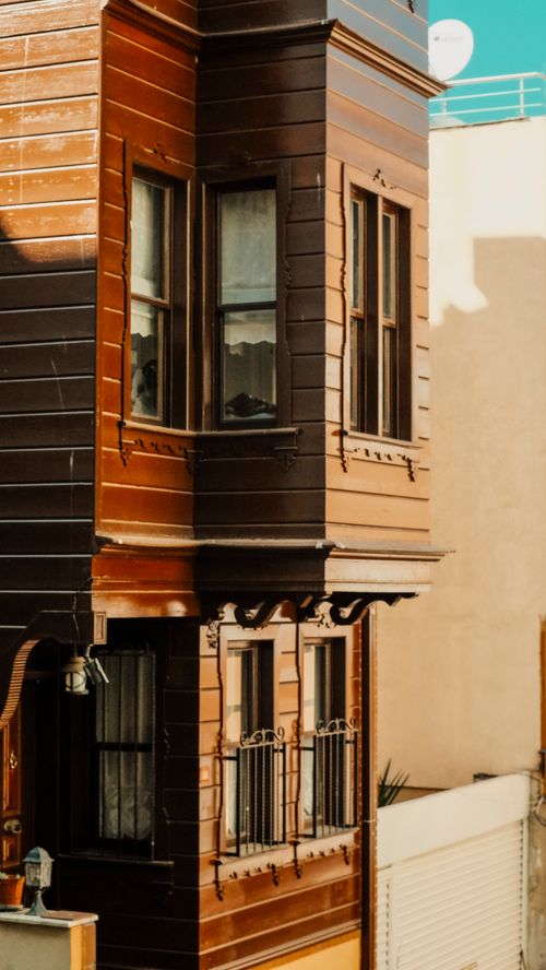 Free A charming wooden building facade in Istanbul showcasing traditional architectural style in an urban setting. Stock Photo