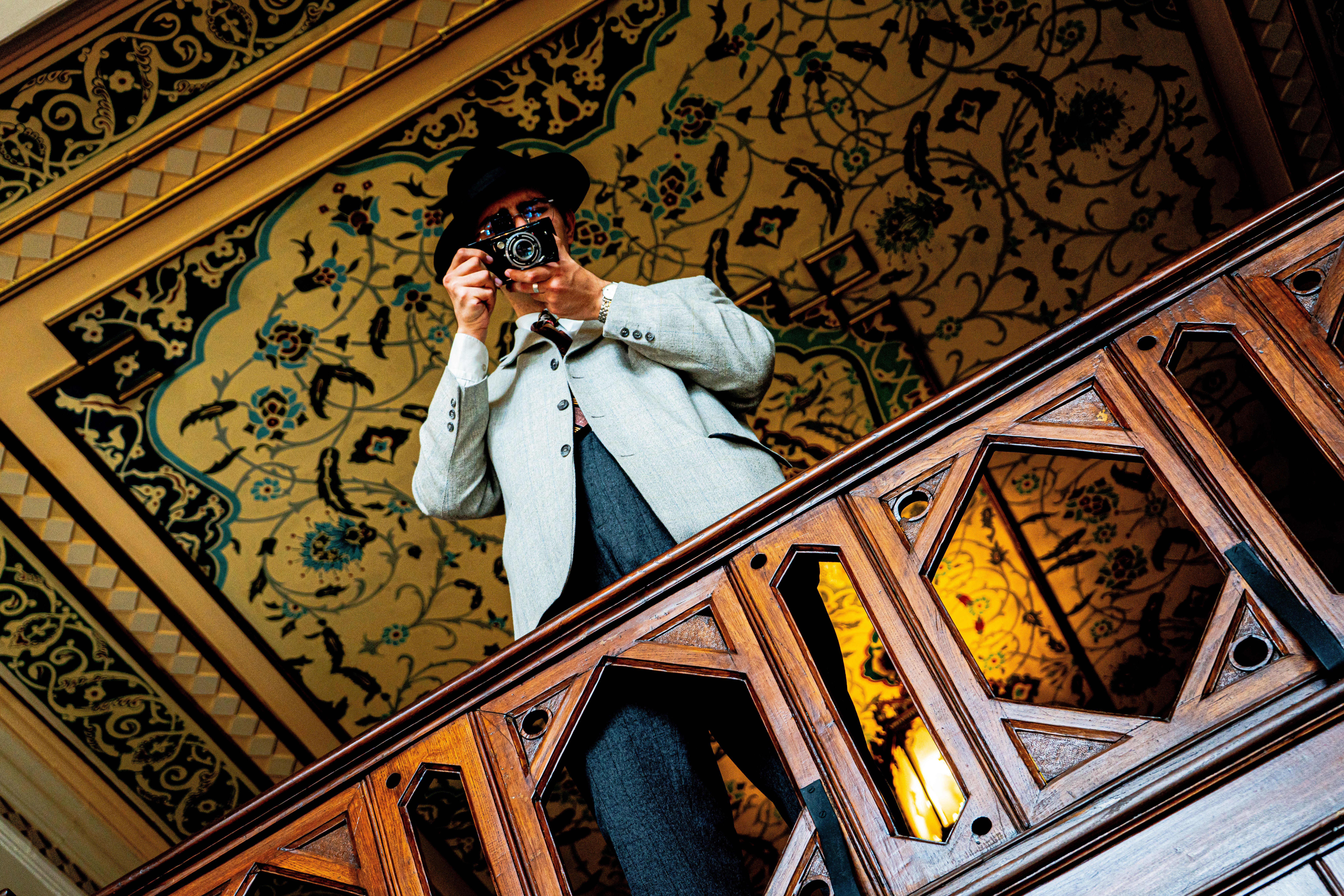 Low Angle View of a Well-Dressed Man Using an Analog Camera · Free ...