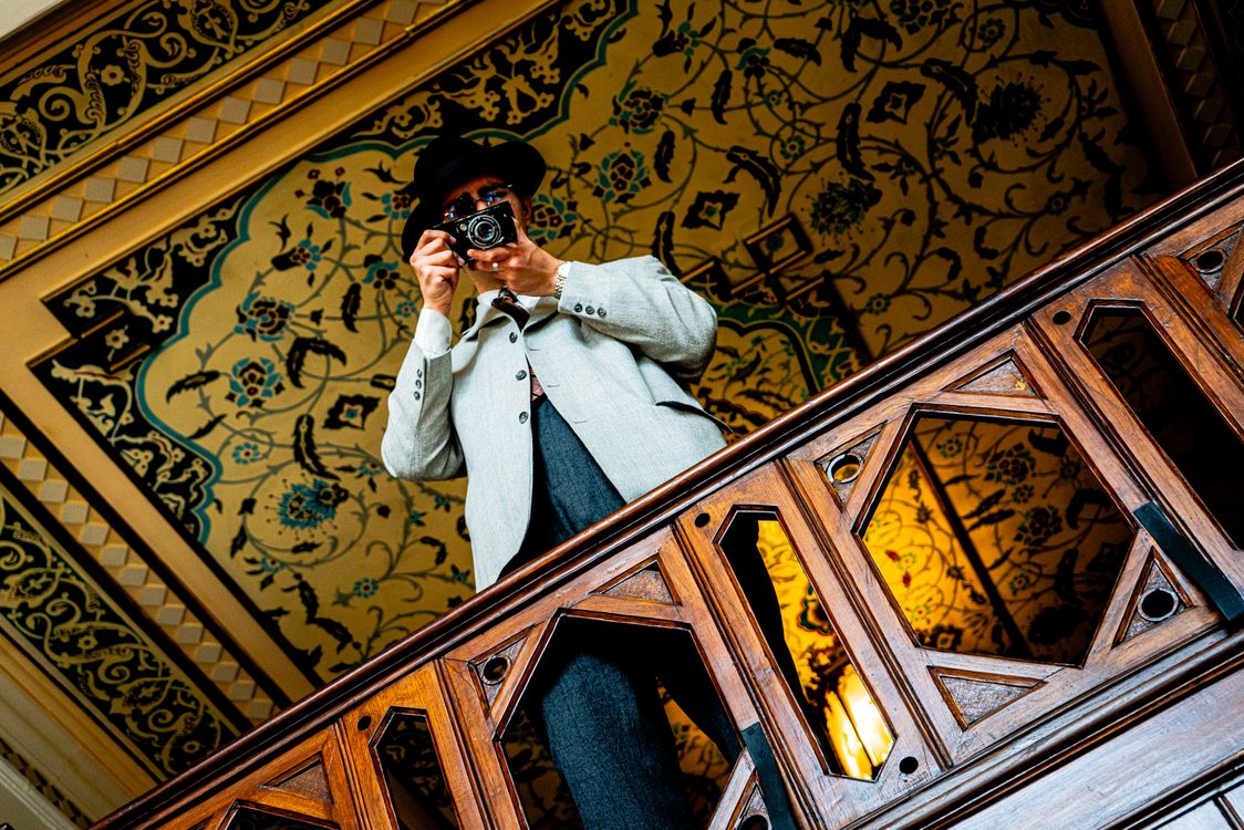 Man Using Camera Monaco Low Angle View of a Well-Dressed Man Using an Analog Camera · Free ...