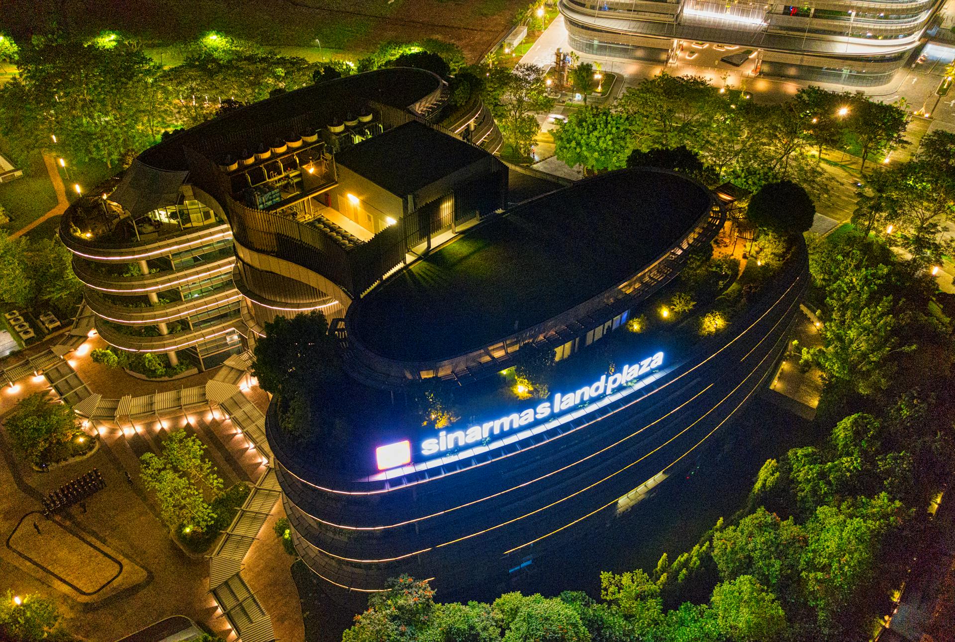 A stunning aerial shot of Sinarmas Land Plaza illuminated at night in Banten, Indonesia.