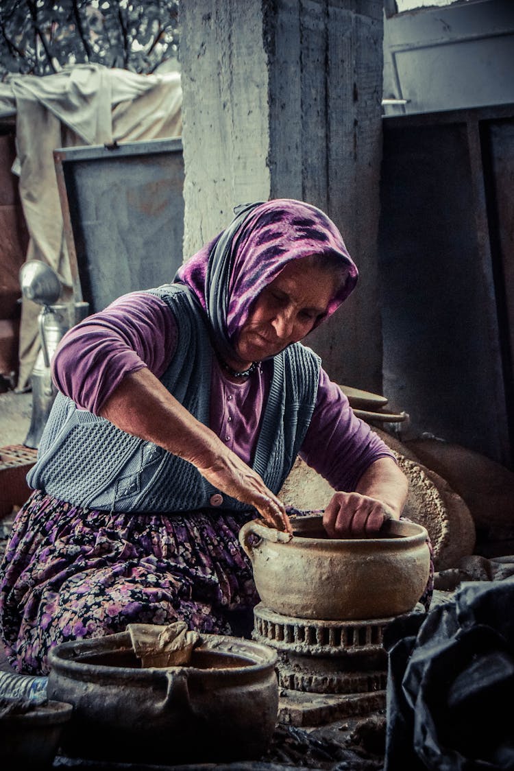 Woman Molding Brown Clay Pot