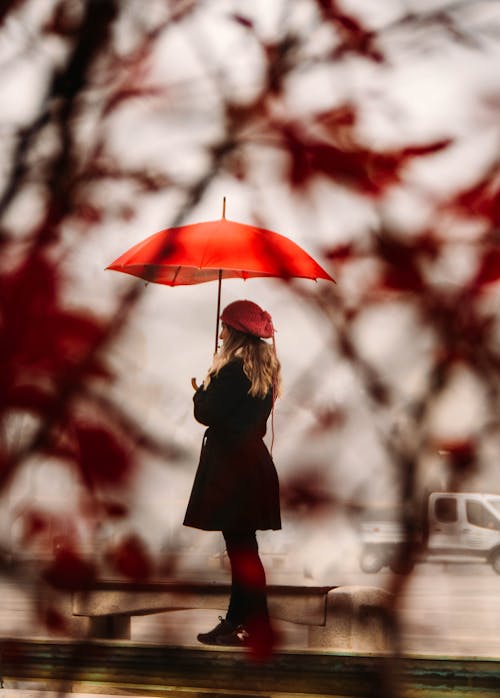 Woman Holding Red Umbrella