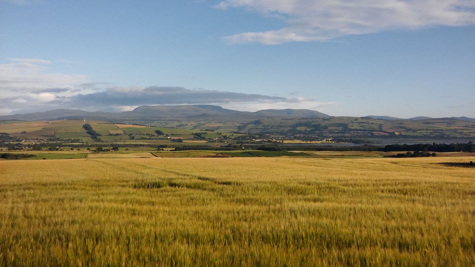 Farmland near Stirling with fields stretching towards the hills