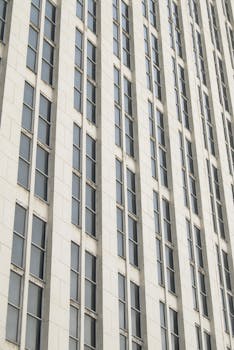 Close-up of a modern office building facade with numerous windows, captured in Moscow.
