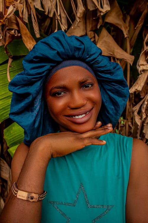 A woman in a turban smiling for the camera