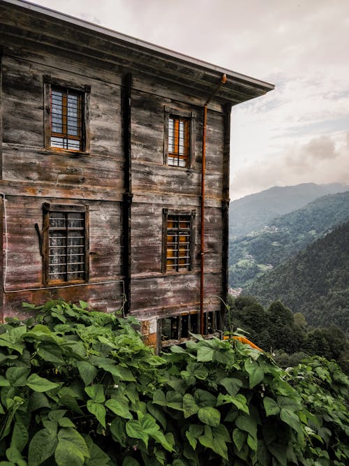 An old wooden house with a view of mountains