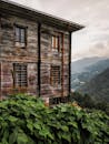 An old wooden house with a view of mountains