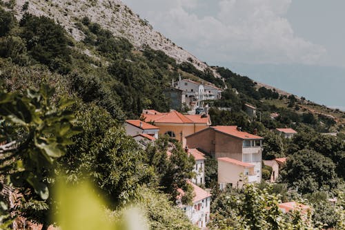 Free Houses On The Foot Of A Mountain Stock Photo