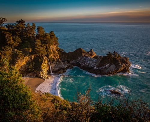 Free Explore the breathtaking McWay Falls at Big Sur, captured during a vibrant sunset. Stock Photo